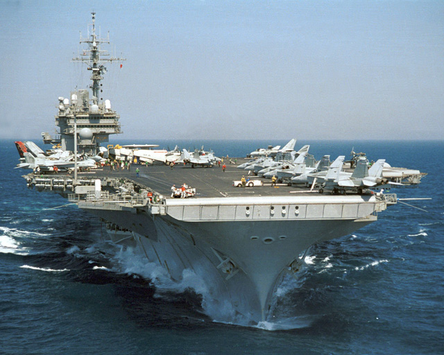 The 60,000 ton, New York Ship built aircraft USS Kitty Hawk (CV-63) pictured in the western Pacific Ocean in 2003. Over its forty year career, Kitty Hawk has operated off Vietnam, Desert Shield, Desert Storm, and Operation Iraqi Freedom.